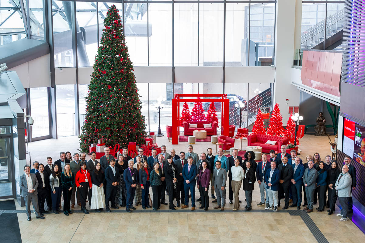 Jeffrey Meyer professionally photographs three dozen corporate executives during a huge group photo at Rogers Centre, Ottawa