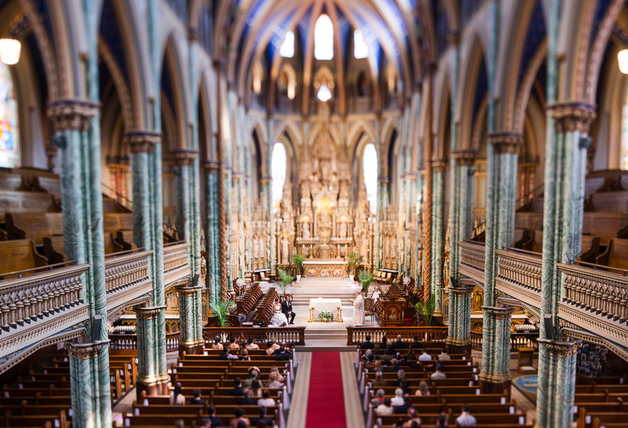 Couple exchanging vows in the historic Notre-Dame-Cathedral Basilica.