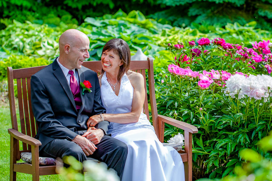 Danielle and Brian share an intimate moment during their backyard wedding ceremony in Orleans, Ontario.